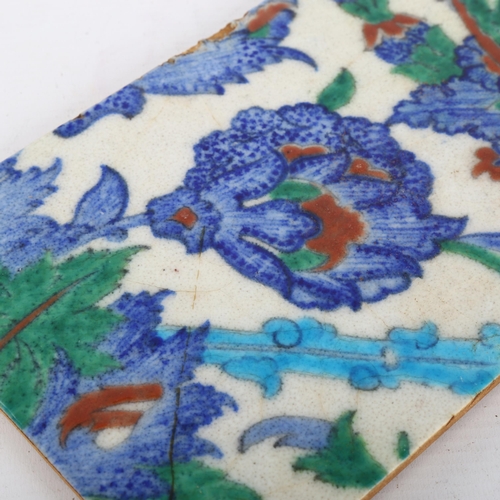 1141 - A Middle Eastern Iznik pottery tile, 24cm x 16cm