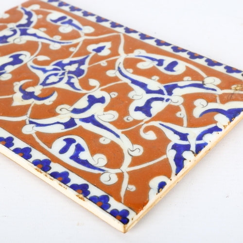 1143 - A Middle Eastern Iznik pottery tile, 16.5cm x 24cm