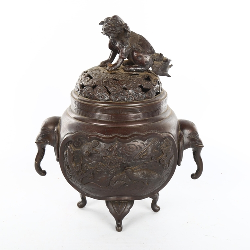 1158 - A Chinese patinated bronze incense burner, with dog of fo finial and elephant handles, height 28cm