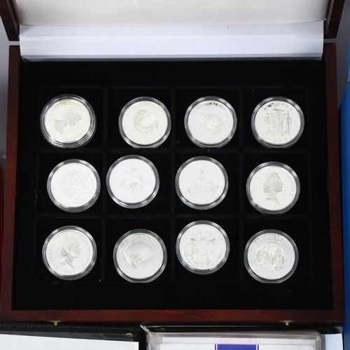 1163 - A collection of commemorative silver coins and medallions, including the Official Coin Collection in... 