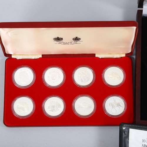 1163 - A collection of commemorative silver coins and medallions, including the Official Coin Collection in... 