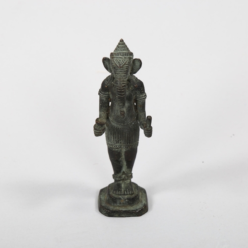 1169 - An Indian patinated bronze figure of Ganesh, height 14cm