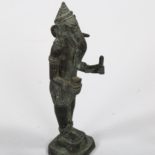 1169 - An Indian patinated bronze figure of Ganesh, height 14cm