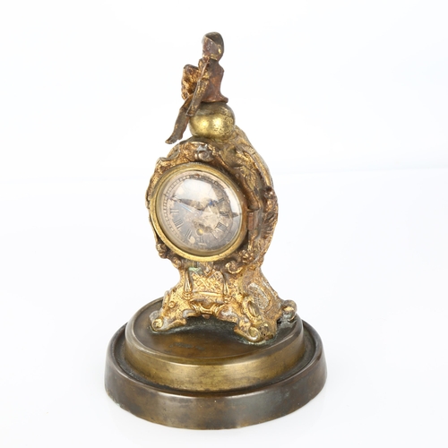 1062 - 19th century French gilt-metal cased miniature clock, surmounted by a figure of Napoleon, movement s... 