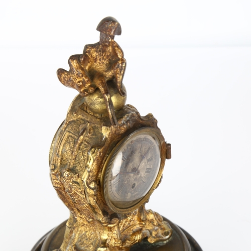 1062 - 19th century French gilt-metal cased miniature clock, surmounted by a figure of Napoleon, movement s... 