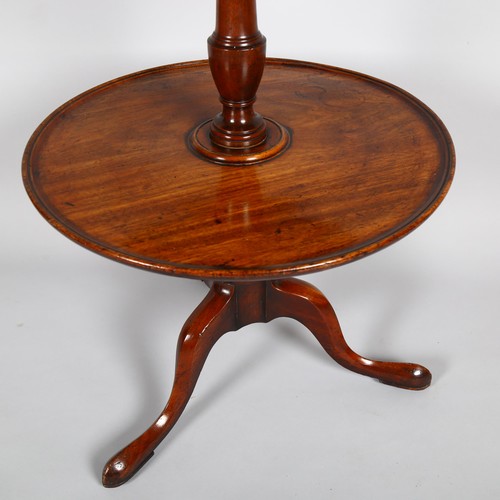 1028 - A George III circular mahogany 3-tier dumb waiter on tripod base, height 110cm, lower tier diameter ... 