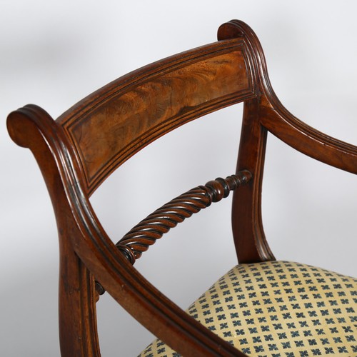 1030 - A William IV mahogany desk chair with rope twist back rail