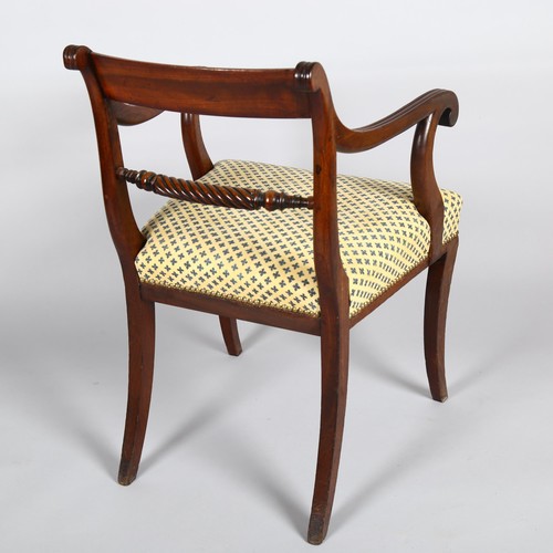 1030 - A William IV mahogany desk chair with rope twist back rail