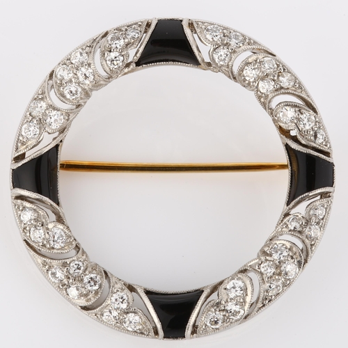101 - TIFFANY & CO - an Art Deco onyx and diamond brooch, unmarked white metal settings in circular form, ... 