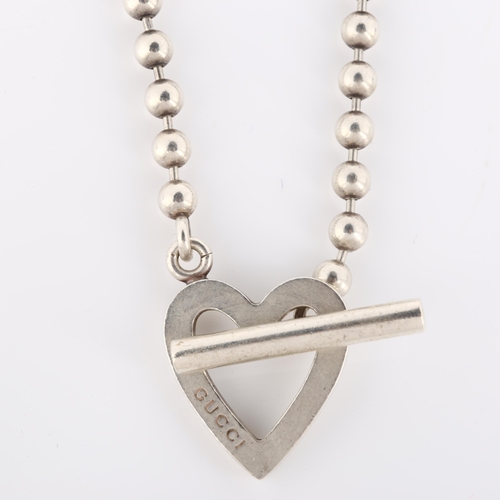 103 - GUCCI - an Italian sterling silver heart toggle necklace, with ball links, necklace length 36cm, 22.... 