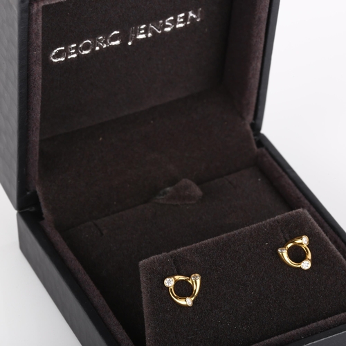 105 - GEORG JENSEN - a pair of 18ct gold diamond Magic earrings, set with modern round brilliant-cut diamo... 