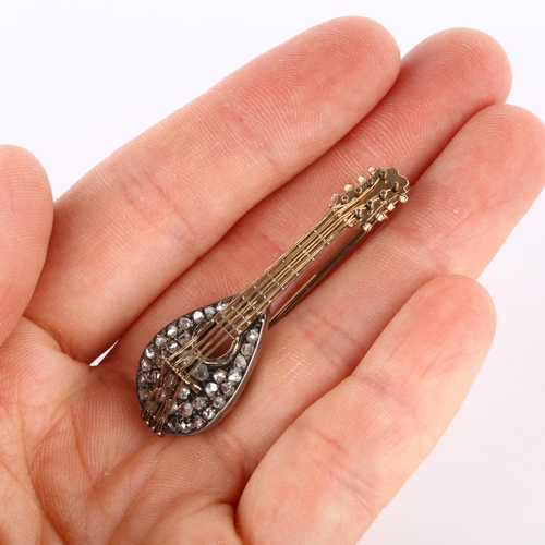 110 - An Antique novelty diamond mandolin musical instrument brooch, circa 1900, unmarked rose gold and si... 
