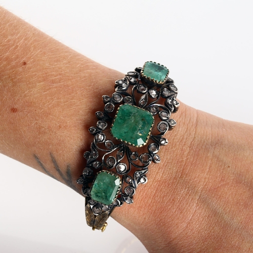 120 - A fine Victorian emerald and diamond hinged bangle, unmarked gold and silver-topped openwork setting... 