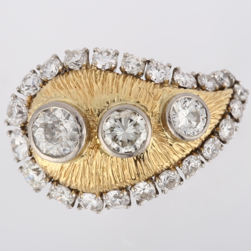 123 - WILLIAM RUSER - a platinum gold and diamond tear-drop cocktail ring, the textured tear-drop panel wi... 