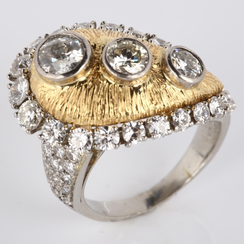 123 - WILLIAM RUSER - a platinum gold and diamond tear-drop cocktail ring, the textured tear-drop panel wi... 