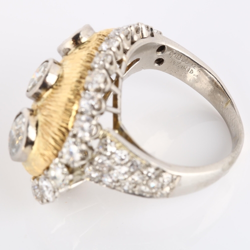 123 - WILLIAM RUSER - a platinum gold and diamond tear-drop cocktail ring, the textured tear-drop panel wi... 