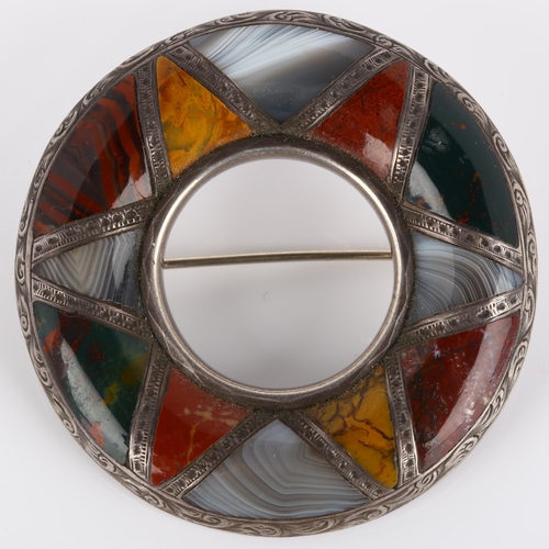 124 - A 19th century Scottish hardstone brooch, unmarked silver closed-back settings in circular form, wit... 