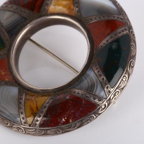 124 - A 19th century Scottish hardstone brooch, unmarked silver closed-back settings in circular form, wit... 