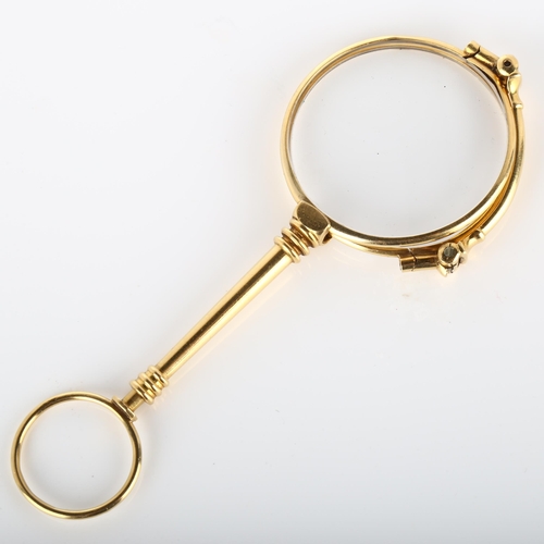 127 - A pair of 19th century French gold lorgnettes, with ring turned spring release catch, closed length ... 