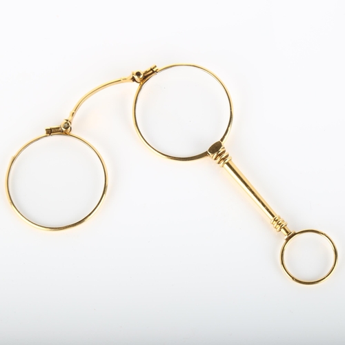 127 - A pair of 19th century French gold lorgnettes, with ring turned spring release catch, closed length ... 