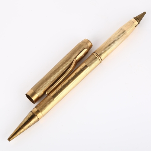 130 - A mid-20th century 9ct gold combination propelling pencil/ballpoint pen, engine turned case with 9ct... 