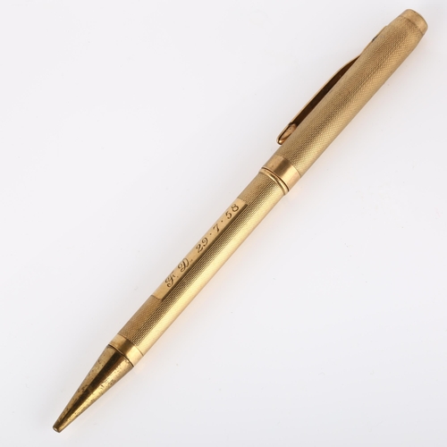 130 - A mid-20th century 9ct gold combination propelling pencil/ballpoint pen, engine turned case with 9ct... 