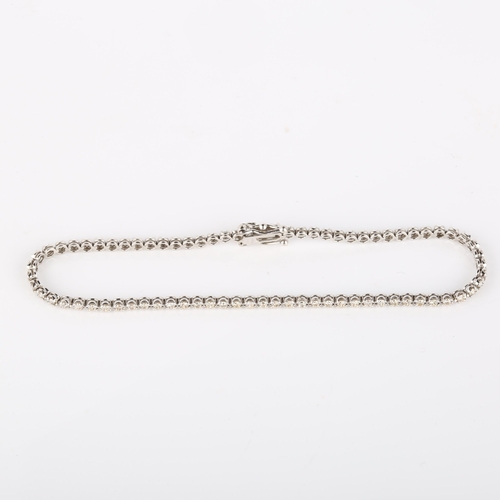 131 - A modern 18ct white gold diamond tennis line bracelet, set with modern round brilliant-cut diamonds,... 