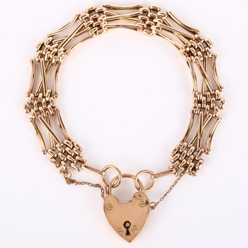 134 - An early/mid-20th century unmarked rose gold gatelink bracelet, with 9ct heart padlock clasp, maker'... 