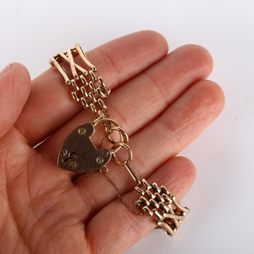 134 - An early/mid-20th century unmarked rose gold gatelink bracelet, with 9ct heart padlock clasp, maker'... 