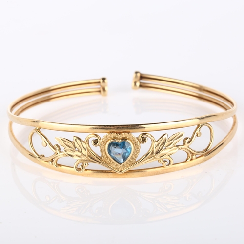 139 - A modern 9ct gold blue topaz heart torque bracelet, openwork floral design, setting height 13.9mm, i... 