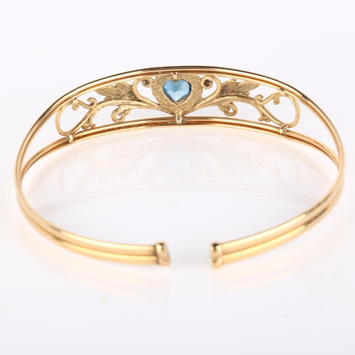 139 - A modern 9ct gold blue topaz heart torque bracelet, openwork floral design, setting height 13.9mm, i... 