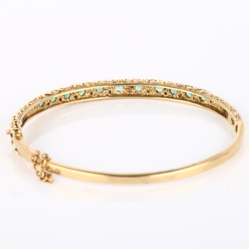 140 - A 9ct gold emerald and diamond hinged bangle, set with round-cut emerald and single-cut diamonds, ba... 