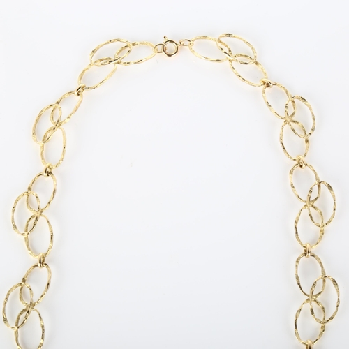 147 - A late 20th century 9ct gold abstract hoop necklace, textured design, necklace length 60cm, 29g