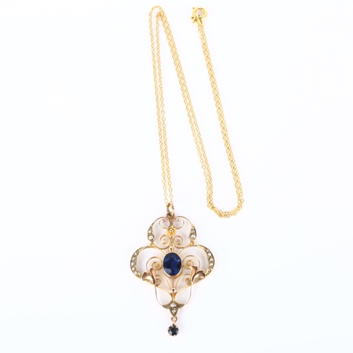 150 - An Edwardian Art Nouveau 9ct gold stone set openwork pendant necklace, set with oval mixed-cut synth... 