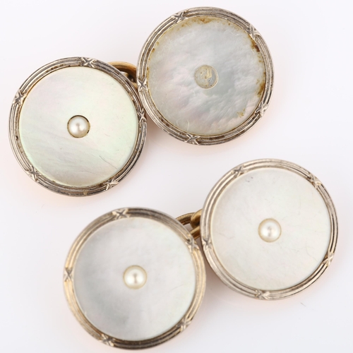 155 - A pair of Art Deco 9ct rose gold mother-of-pearl cufflinks, circular panels with central split pearl... 