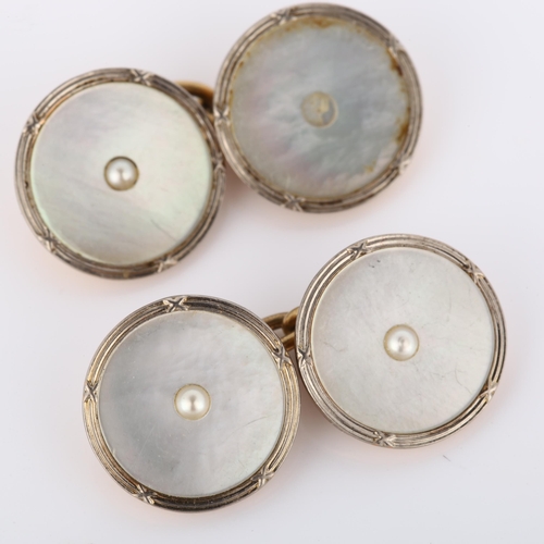 155 - A pair of Art Deco 9ct rose gold mother-of-pearl cufflinks, circular panels with central split pearl... 