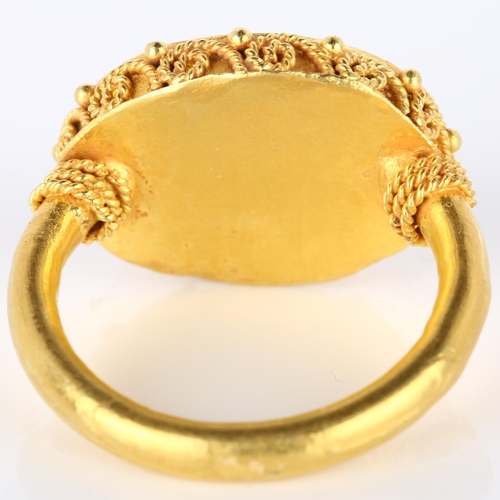 160 - A Victorian style seal ring, unmarked high carat gold settings with wirework surround and intaglio c... 