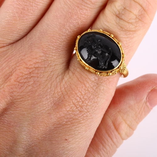 160 - A Victorian style seal ring, unmarked high carat gold settings with wirework surround and intaglio c... 