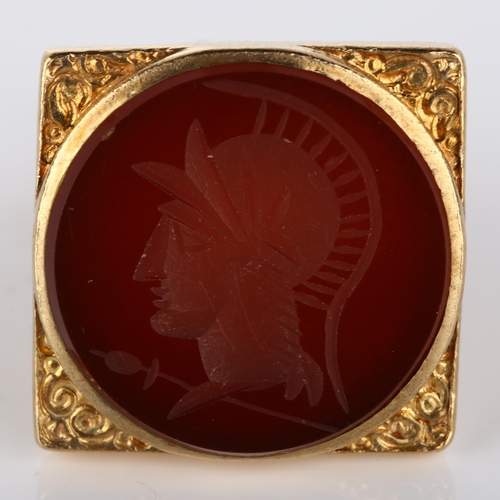 164 - A mid-20th century 9ct gold carnelian seal fob, intaglio carved depicting head of Centurion, in pier... 