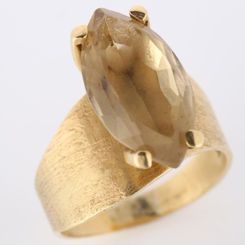 168 - A late 20th century 14ct gold citrine dress ring, set with marquise-cut citrine and textured shoulde... 