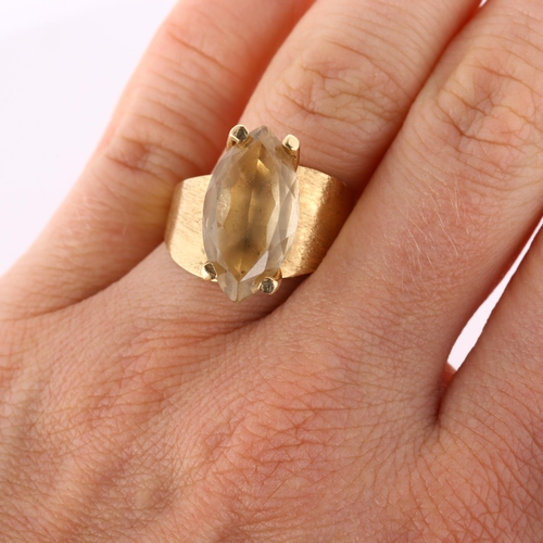 168 - A late 20th century 14ct gold citrine dress ring, set with marquise-cut citrine and textured shoulde... 