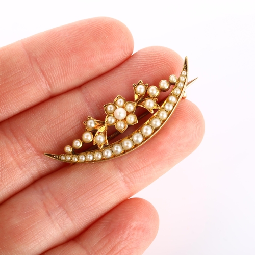 177 - A Victorian split pearl flowerhead crescent brooch, unmarked gold settings, brooch length 39.6mm, 4.... 