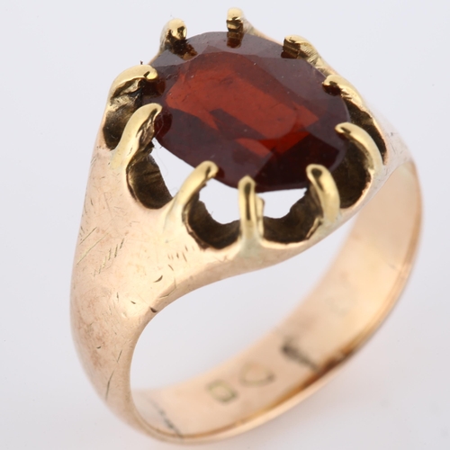 179 - An early 20th century 9ct rose gold garnet dress ring, set with oval mixed-cut garnet and engraved s... 