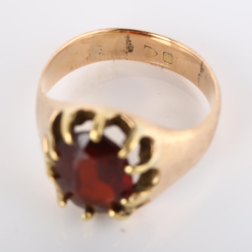 179 - An early 20th century 9ct rose gold garnet dress ring, set with oval mixed-cut garnet and engraved s... 