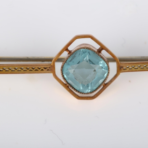 182 - An Art Deco 9ct gold blue topaz bar brooch, pierced openwork decoration, brooch length 63.6mm, 4g