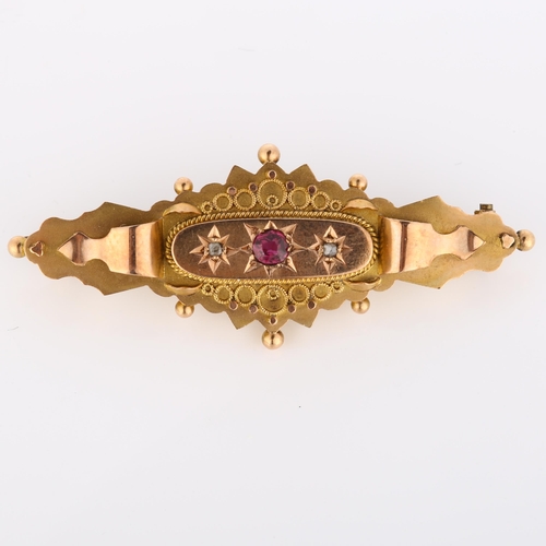 200 - An early 20th century 9ct rose gold Etruscan Revival brooch, set with round-cut ruby and rose-cut di... 