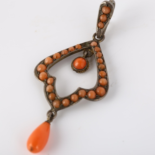 203 - A Continental Art Nouveau coral openwork pendant, unmarked white metal settings, maker's marks AV, p... 