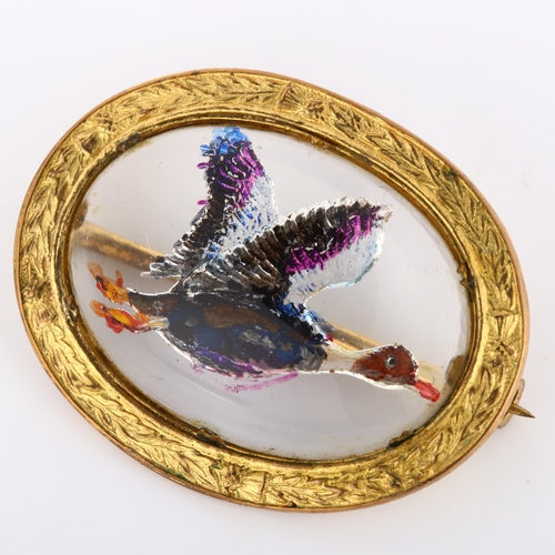 205 - An Essex Crystal style mallard brooch, relief moulded and painted, in gilt-metal frame inscribed Miz... 