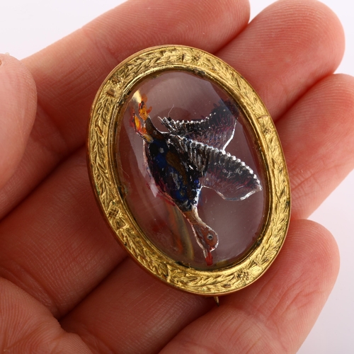 205 - An Essex Crystal style mallard brooch, relief moulded and painted, in gilt-metal frame inscribed Miz... 