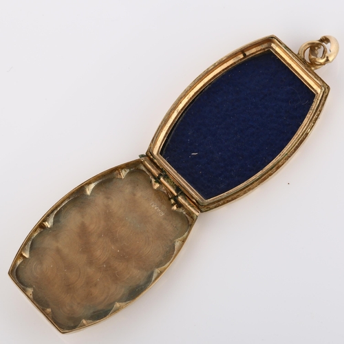 206 - A mid-20th century 9ct gold photo locket pendant, with engraved sunburst decoration, hallmarks Birmi... 